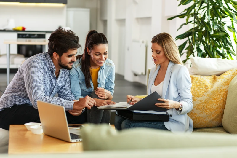 Couple seating with a mortgage professional.