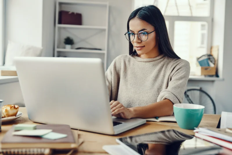 Woman working on her laptop.