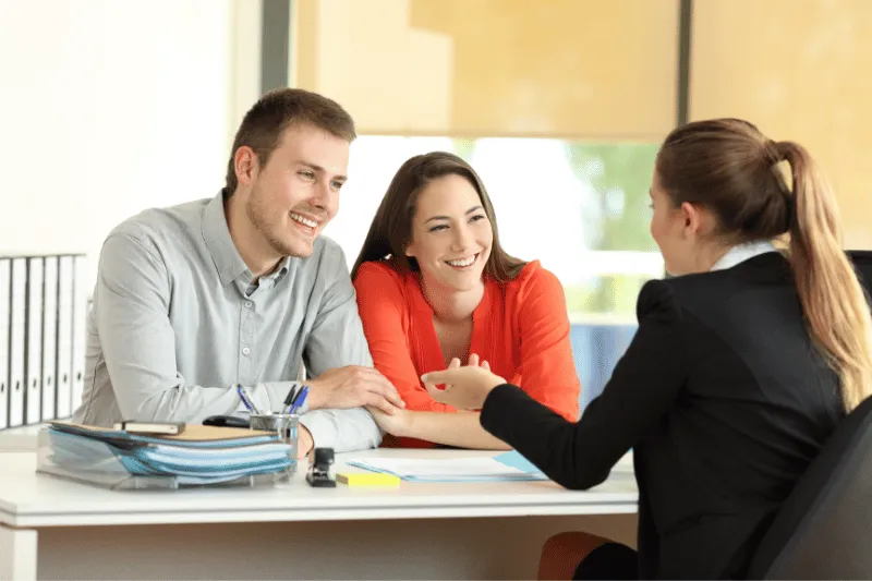 Young couple talking to a professional.