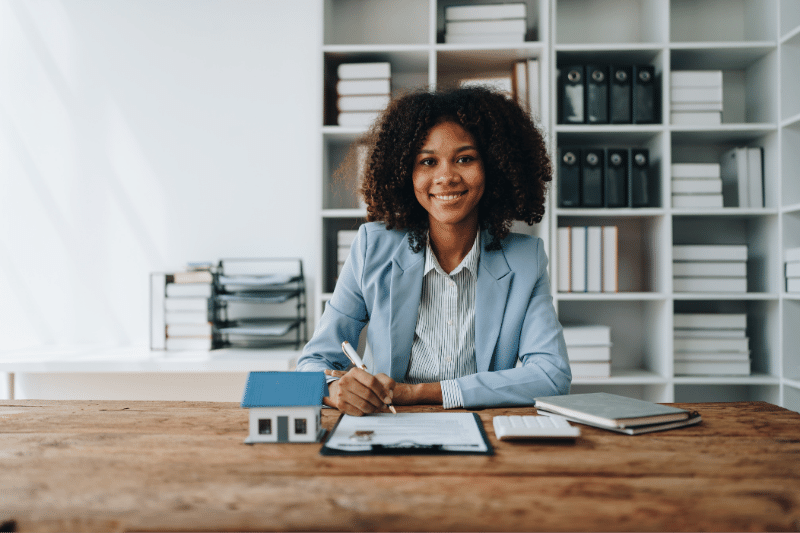 Woman mortgage professional with a notepad.