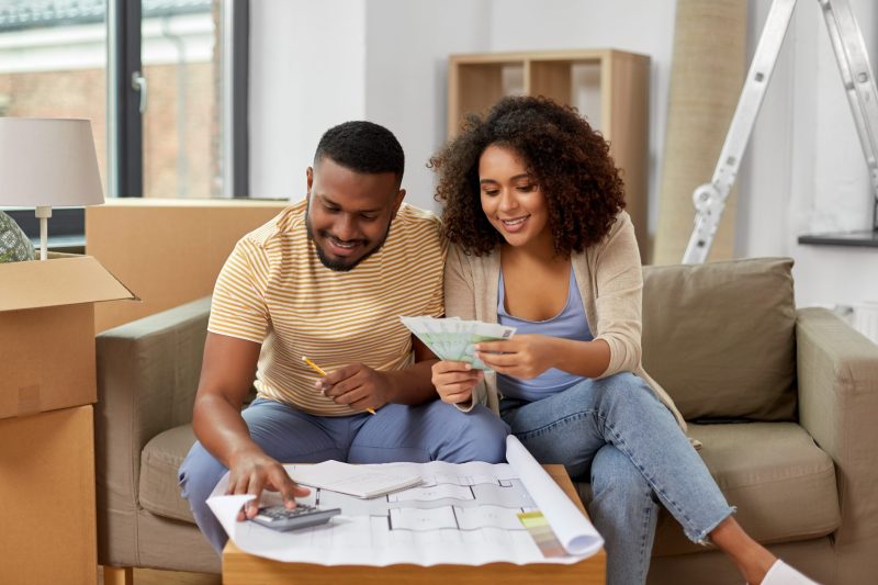 Couple looking over a blueprint of their new home.